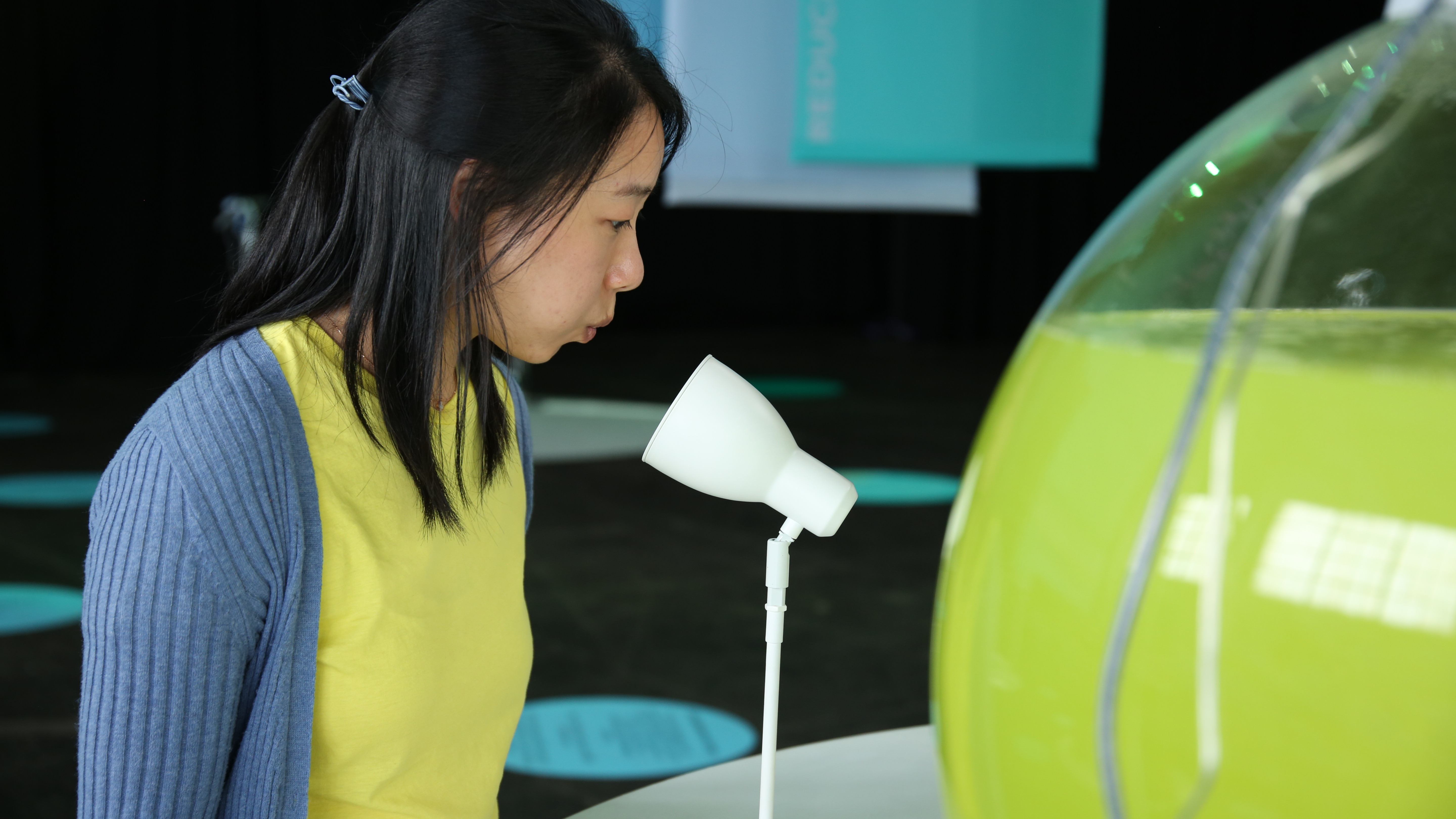 Algae Globe table close up which shows air funnel where visitors interact by blowing