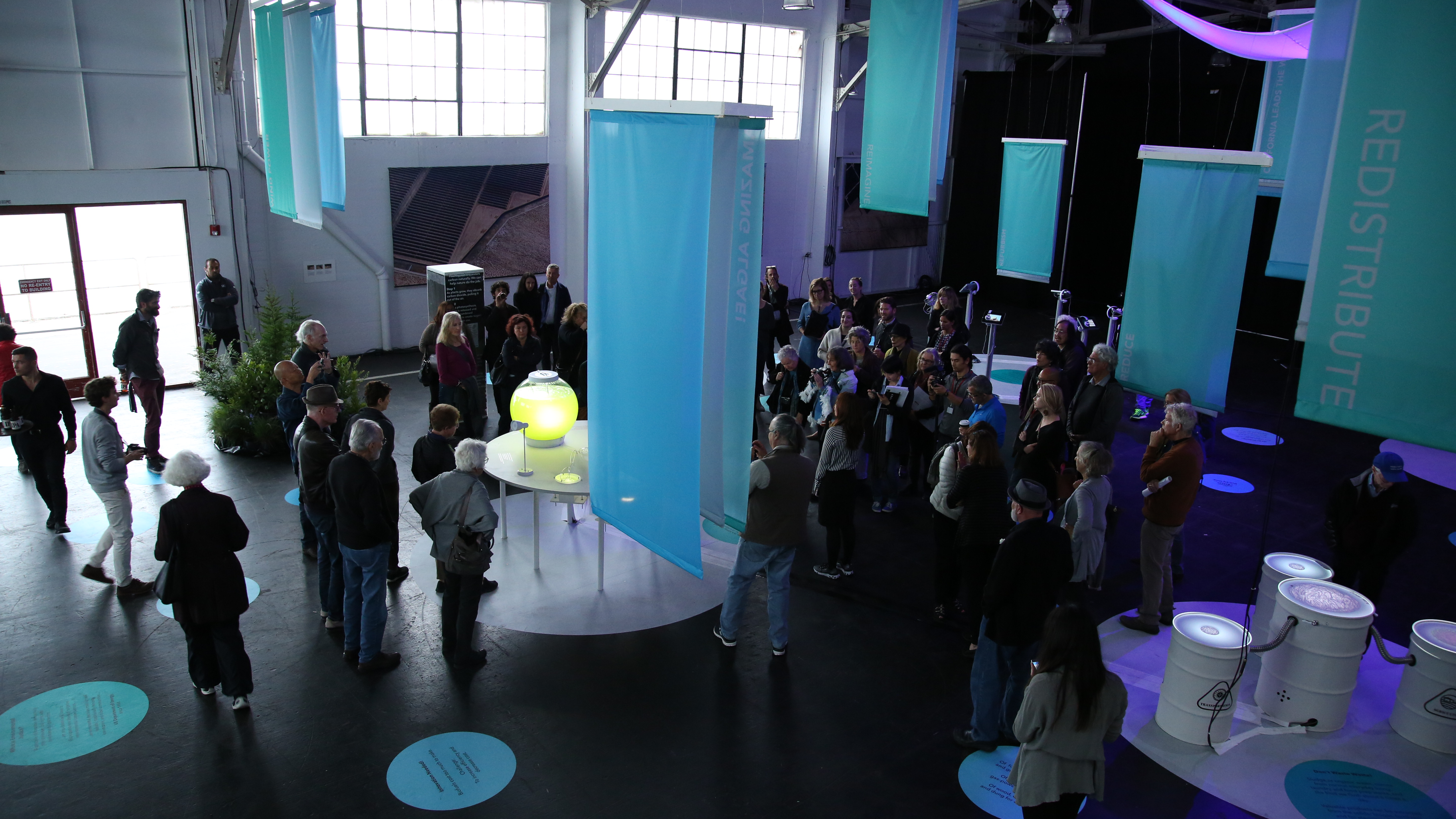 Photo of the Solutions Zone with a large group of people in it